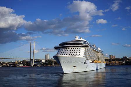Golden horn Bay with a cruise ship on the background of the bridge. Vladivostok, Russiaの写真素材