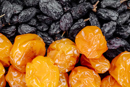 top view of dried cherry plums with black raisinsの写真素材