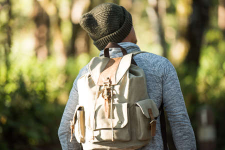 Men traveller going alone in the wild