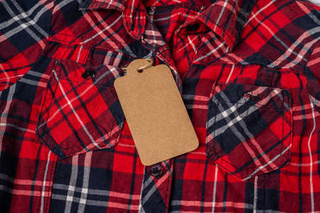 Red plaid shirt with tagの写真素材