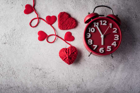 Red alarm clock with Red heart, Valentines day concept.の写真素材