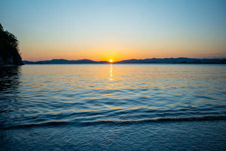 Marine landscape with views of a beautiful sunset. Nakhodka Bay, Russiaの写真素材