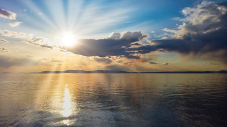 seascape with colorful cloudy sky over a body of waterの写真素材