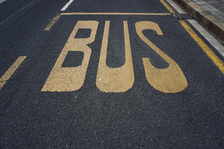 bus stop symbol on the roadの写真素材