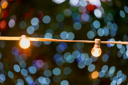 Yellow light bulbs on a blurry background with bokeh
