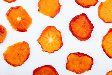 top view of dried persimmon slices isolated on white backgroundの写真素材