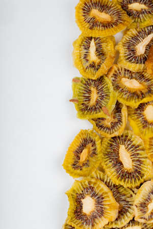 top view of dried kiwi slices isolated on white background with copy spaceの写真素材