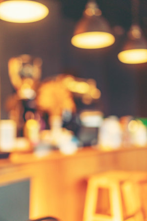 abstract blurry background of coffee cafe shop, out of focus shot, vintage filter imageの写真素材