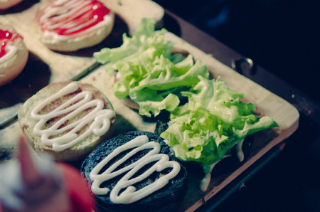 Hamburger with vegetables and cheese.Vintage filterの素材