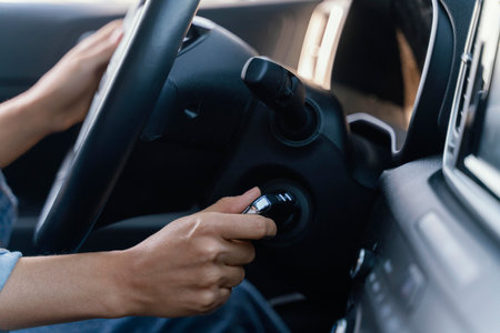 Woman starting the engine of her carの素材