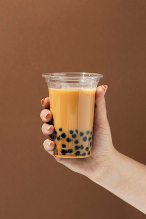 Composition with delicious traditional thai tea backgroundの素材