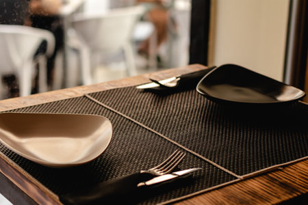 table prepared for customers in restaurantの素材