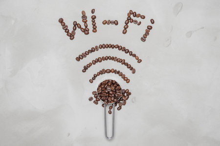 symbol Wi-Fi lined with coffee beans on a white background, coffee beans forms a wifi symbolの素材