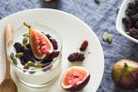 Greek yogurt with Fig ,Mulberries and pumpkin seed in a glassの素材