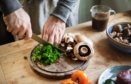 Man slicing portobello mushroomsの素材