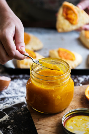 Homemade scones with orange jam food photography recipe ideaの素材
