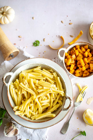 Cooked casarecce pasta in a bowl aerial viewの素材