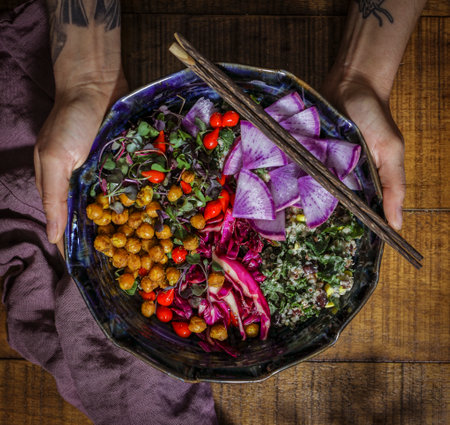 Woman having organic buddha bowl for lunchの素材