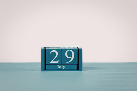 A blue calendar block displaying the date 29 July on a light blue surface with a white background.