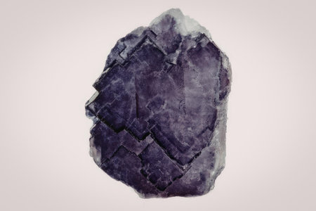 A large, rough, purple amethyst geode on a white background.