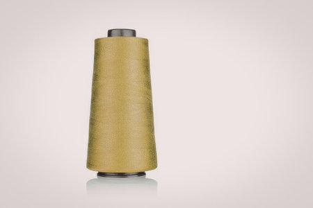 A spool of thread on a white background