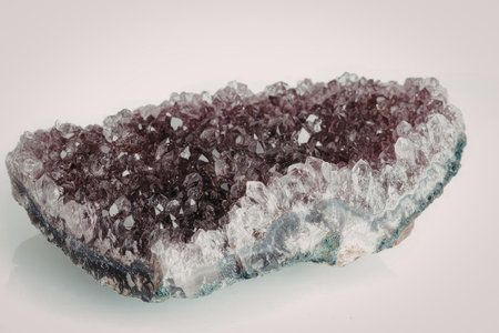 A stunning amethyst geode with sparkling crystals, showcasing a rich purple color and unique...