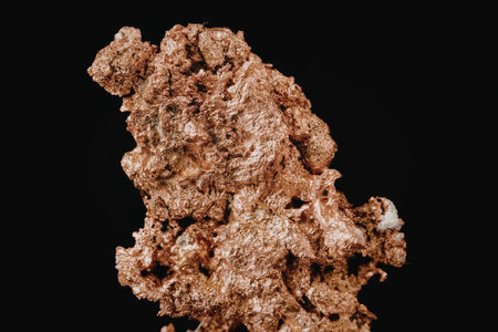 A close-up view of a copper ore mineral specimen with a rough, porous texture and reddish-brown...