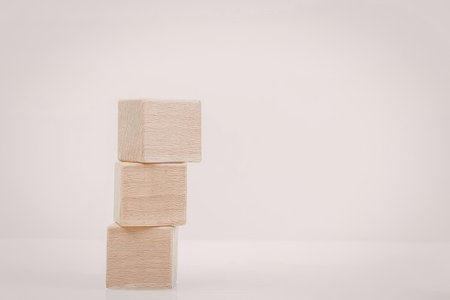 Three wooden blocks stacked on top of each other