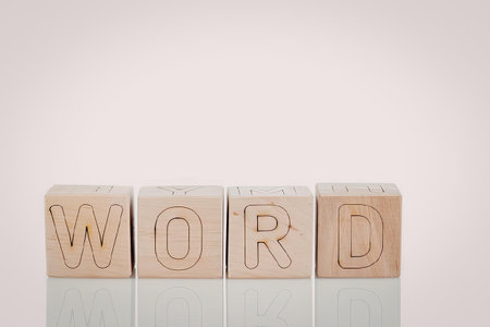 Four wooden blocks with the word 'WORD' engraved on them