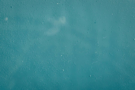 A serene and calming blue background with a subtle texture, evoking feelings of tranquility and...
