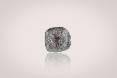 A single diamond gemstone is showcased on a white background, highlighting its unique shape and...