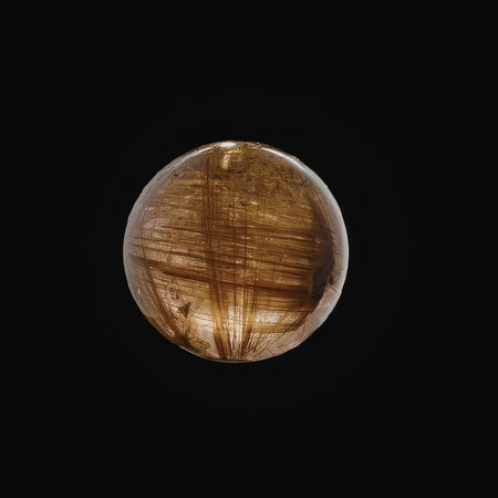 A large brown sphere with golden lines on a black background.