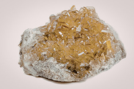 A cluster of citrine crystals with a rough, rocky exterior and a sparkling, crystalline interior.