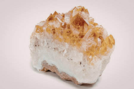 A piece of crystal with orange and white colors