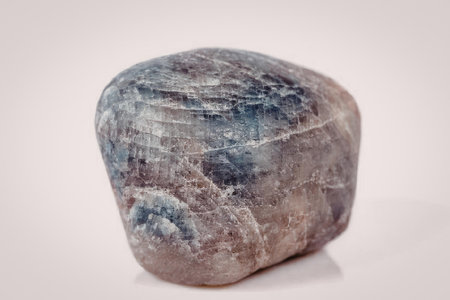 A close-up image of a large gray rock with blue undertones, showcasing its unique texture and color.