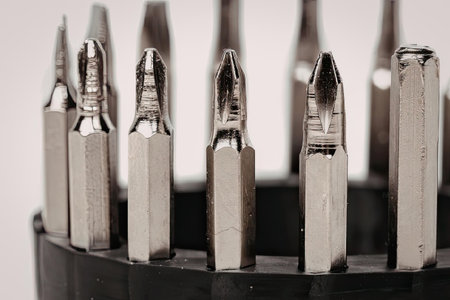 A close-up view of various screwdriver bits arranged in a black holder, showcasing their tips and...