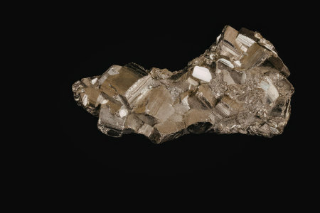 A cluster of shiny pyrite crystals on a black background
