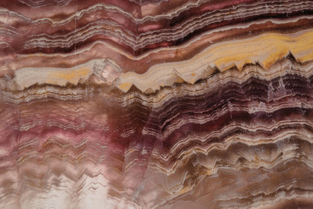 The image shows a colorful rock formation with multiple layers of different colors.