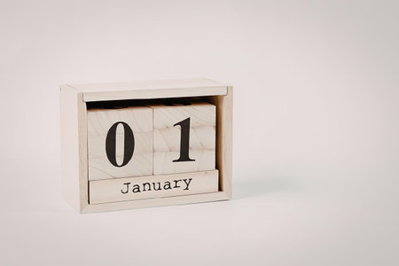 A small wooden calendar block displaying the date January 1.の写真素材