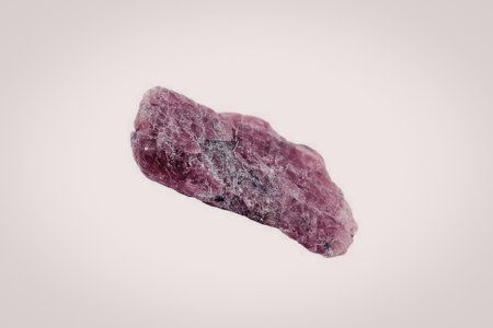 The image features a vibrant pink crystal set against a plain white background. The crystal's...