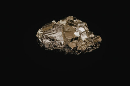 A large piece of pyrite mineral with a metallic luster, showcasing its crystalline structure against...
