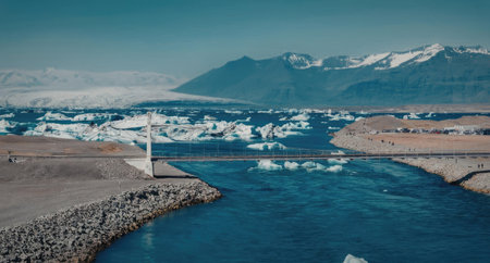 a large body of water with icebergs floating on it, surrounded by mountains