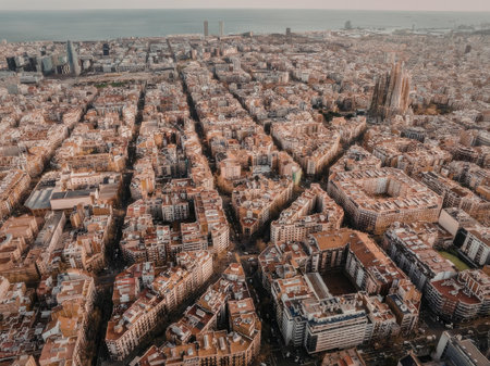 An aerial view of Barcelona city showcasing its unique grid pattern and historic architectureの写真素材