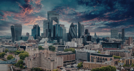 A panoramic view of a modern city with sleek skyscrapers and a vibrant sky during sunset.