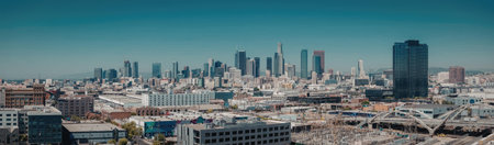 A panoramic view of a bustling metropolis with numerous buildings and skyscrapers set against a...
