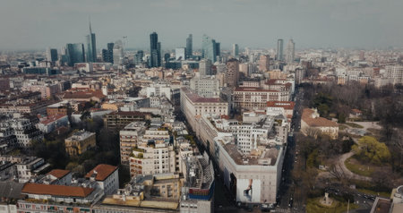 Aerial view of a city with a mix of old and new buildings, showcasing urban landscape and...