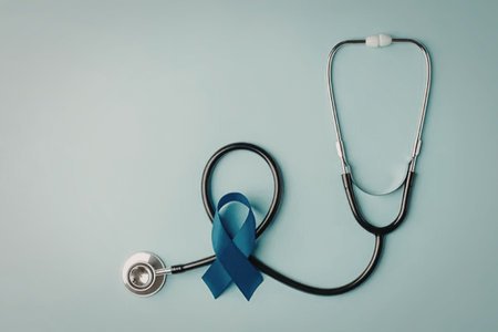 A stethoscope with a blue ribbon on a light blue background, symbolizing health and awareness.の写真素材