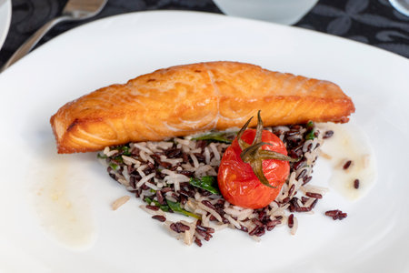 Grilled Salmon Filet with rise and tomatoの写真素材