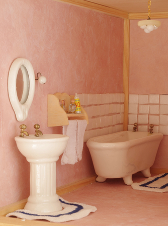 Pink bathroom in a doll house.の写真素材