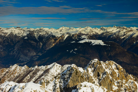 Mountain landscape. Snow-capped peaks against the blue sky with clouds. Orobie ( Bergamasque Alps ), Lombardy, Italyの写真素材
